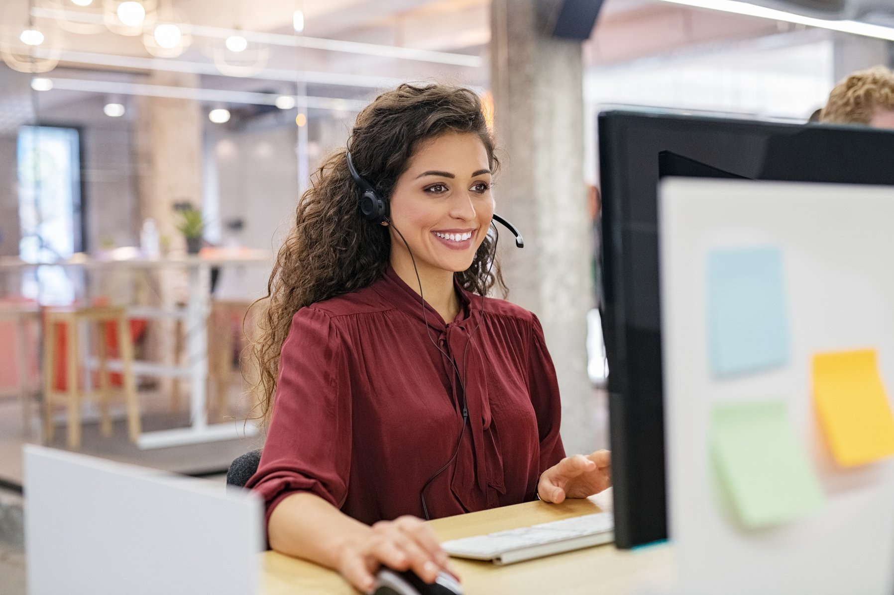 Smiling Woman Working in a Call Center